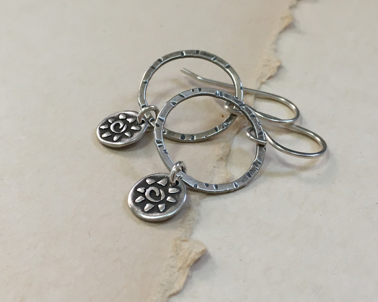 Small hoops with primitive sun dangles in oxidized sterling silver