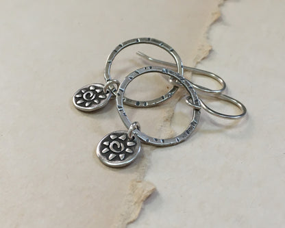 Small hoops with primitive sun dangles in oxidized sterling silver