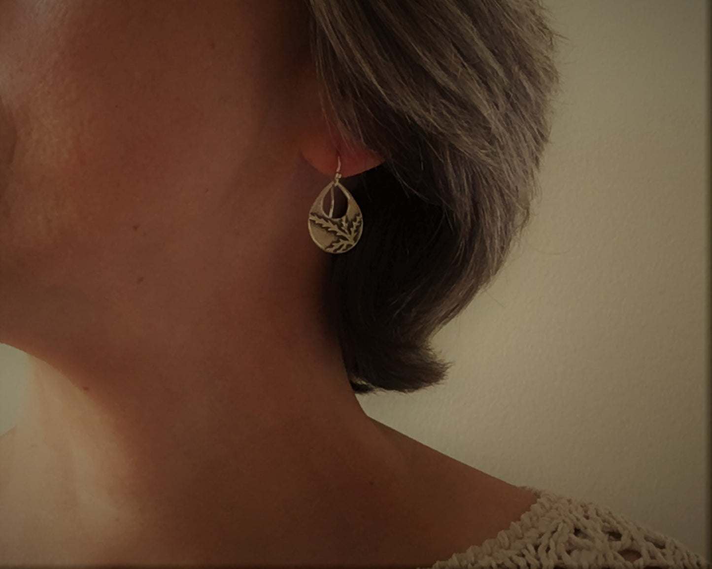 Botanical evergreen design on silver teardrop earrings